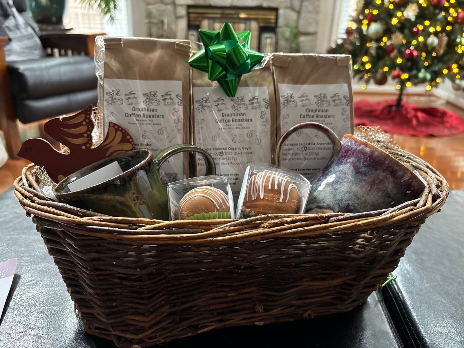 Graphman Coffee Roasters holiday gift basket with coffee, mugs, and treats